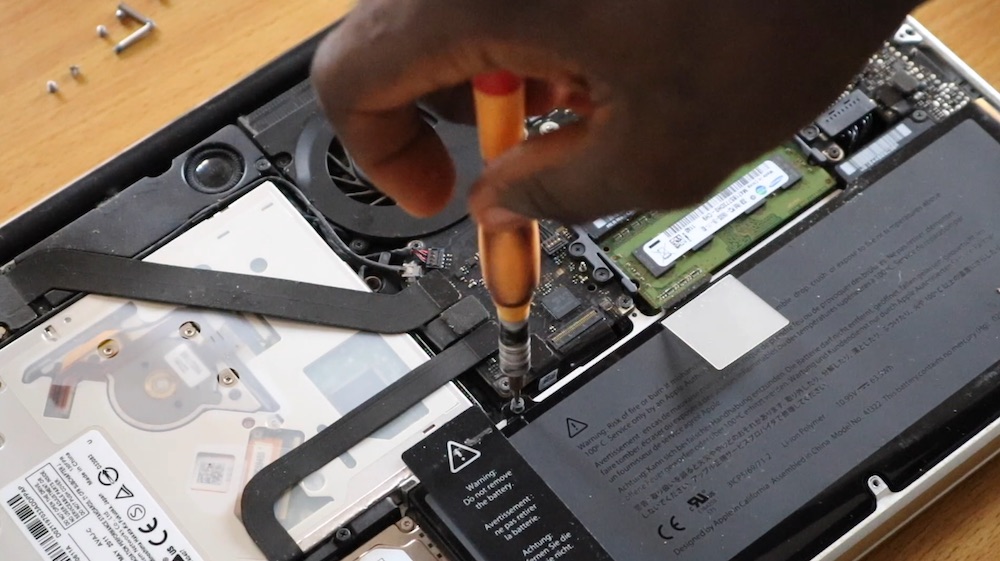 removing the screws holding the battery